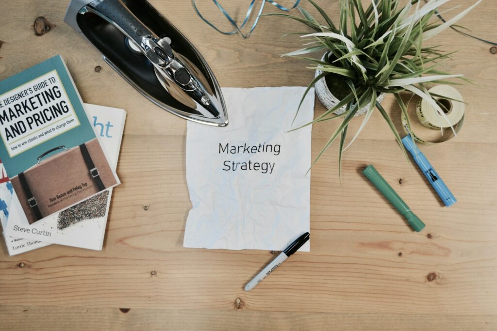 home care marketing software strategy notes spread on a desk next to a laptop
